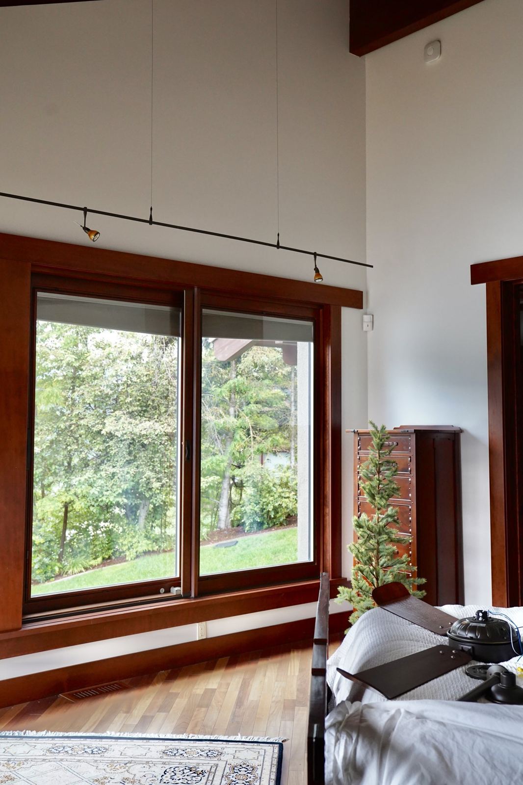 A finished room with clean walls and wood-trimmed windows