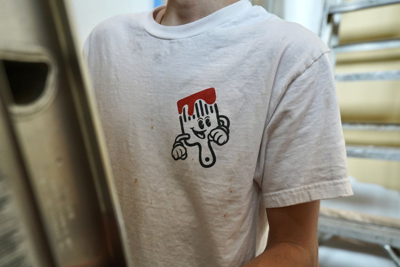 Elliot, the CS Painting brush, on a crew shirt