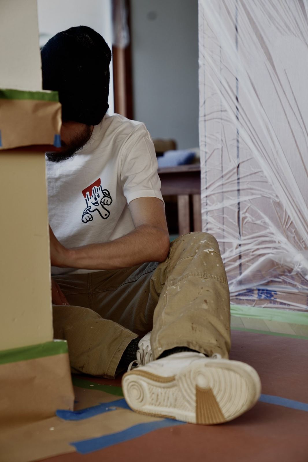 A CS Painting crew member taping and masking before painting